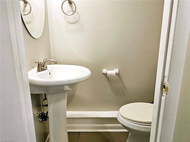 bathroom featuring tile patterned flooring and toilet