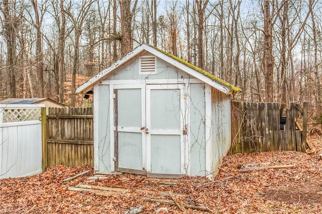 view of shed with fence