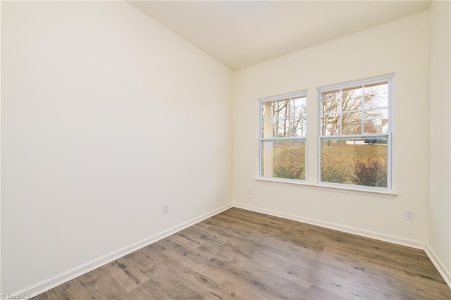 spare room featuring hardwood / wood-style flooring