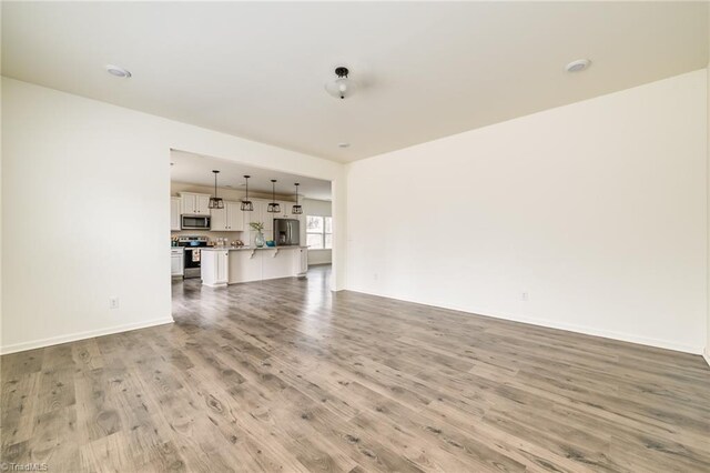 unfurnished living room featuring light wood-type flooring