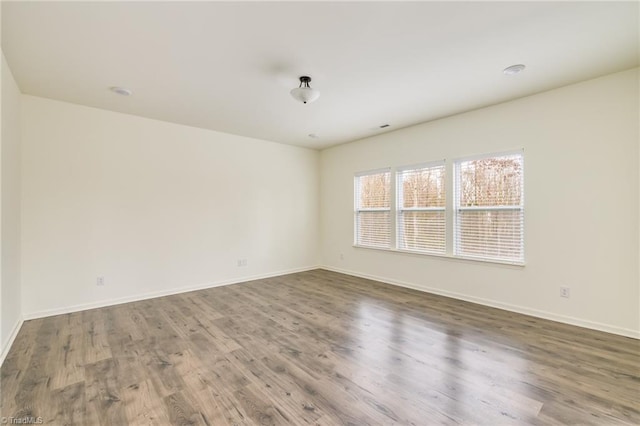 empty room featuring hardwood / wood-style flooring