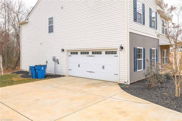 view of side of home with a garage