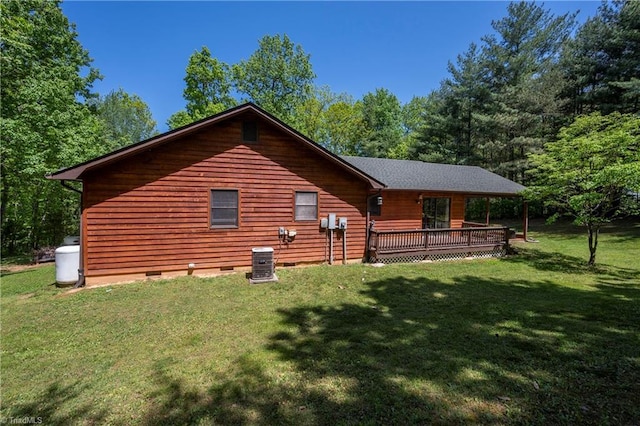 back of house featuring central air condition unit, a yard, a deck, and crawl space