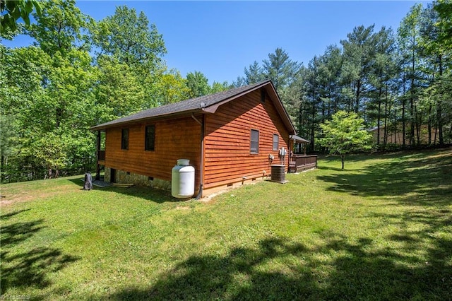 view of side of property featuring central air condition unit, crawl space, a lawn, and a deck