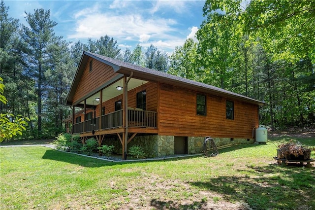 view of side of home featuring a yard