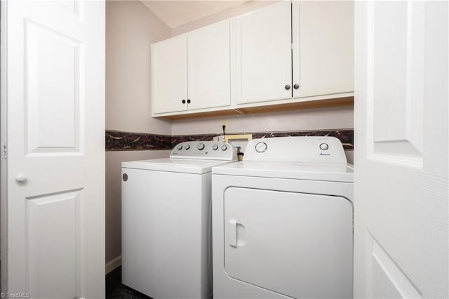 laundry room featuring independent washer and dryer and cabinet space
