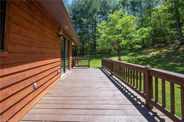 wooden deck with a yard
