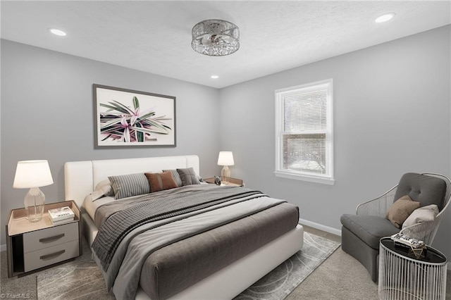 bedroom with dark colored carpet