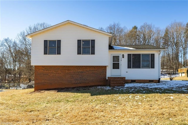 split level home with a front yard