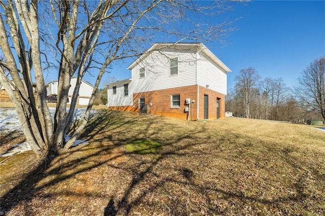 view of property exterior featuring a lawn