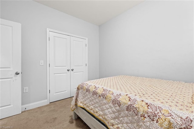 carpeted bedroom featuring a closet