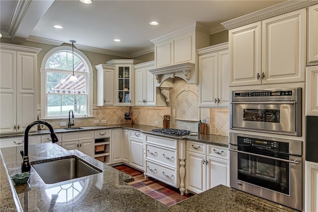 925 Salem Glen Ct, Clemmons, NC 27012 - kitchen with appliances with stainless steel finishes, dark wood finished floors, dark stone counters, recessed lighting, and hanging light fixtures