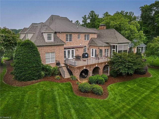 925 Salem Glen Ct, Clemmons, NC 27012 - rear view of property featuring french doors, brick siding, a deck, a lawn, and a chimney