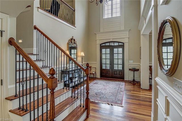 925 Salem Glen Ct, Clemmons, NC 27012 - entryway featuring wood finished floors, a towering ceiling, french doors, stairway, and a chandelier