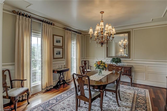 925 Salem Glen Ct, Clemmons, NC 27012 - dining space with a decorative wall, a chandelier, healthy amount of natural light, ornamental molding, and wood finished floors