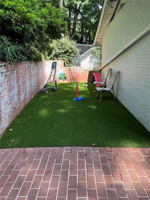 590 Knob View Dr, Winston-Salem, NC 27104 - fenced backyard with a playground