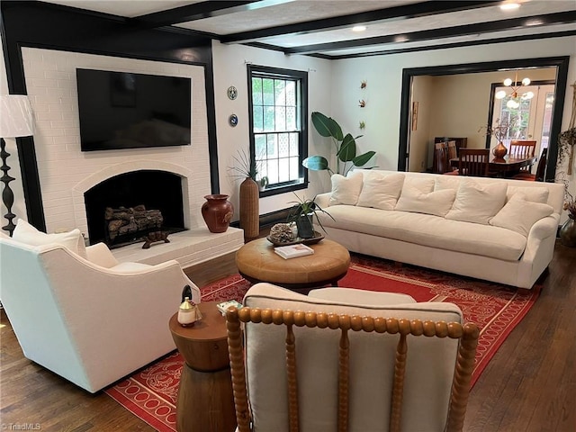 590 Knob View Dr, Winston-Salem, NC 27104 - living room featuring wood finished floors, a chandelier, a fireplace, and beam ceiling