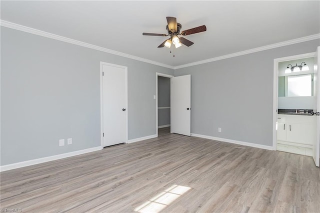 unfurnished bedroom with ensuite bathroom, light hardwood / wood-style flooring, ceiling fan, ornamental molding, and a closet