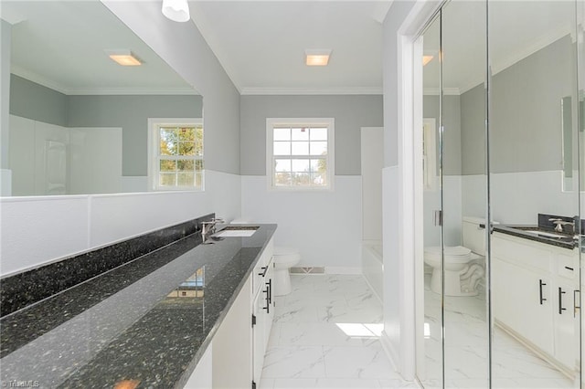 bathroom featuring crown molding, vanity, and toilet