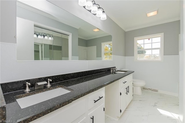 bathroom featuring toilet, vanity, and ornamental molding