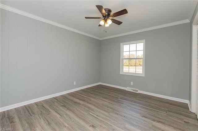 unfurnished room featuring hardwood / wood-style floors, ceiling fan, and ornamental molding