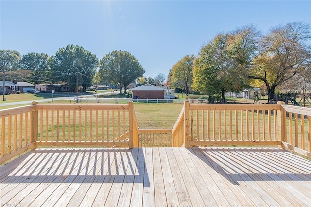 wooden deck with a lawn