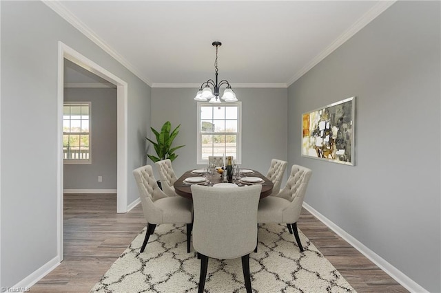 dining area with a chandelier, light hardwood / wood-style floors, and a wealth of natural light