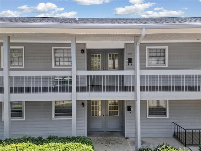 2920 Ramsgate Ct, Winston-Salem, NC 27106 - view of exterior entry with french doors and roof with shingles