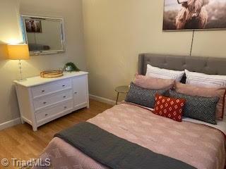 2920 Ramsgate Ct, Winston-Salem, NC 27106 - bedroom with wood finished floors and baseboards