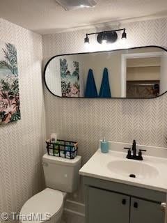 2920 Ramsgate Ct, Winston-Salem, NC 27106 - bathroom with vanity and wallpapered walls