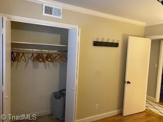 2920 Ramsgate Ct, Winston-Salem, NC 27106 - unfurnished bedroom with crown molding and wood finished floors