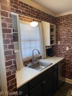 2920 Ramsgate Ct, Winston-Salem, NC 27106 - kitchen with dishwasher, brick wall, ornamental molding, light countertops, and dark cabinets