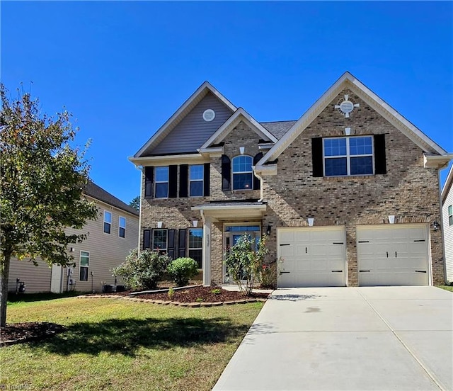 view of front facade featuring a garage and a front yard