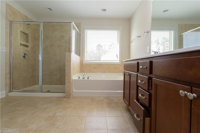 bathroom featuring tile patterned flooring and shower with separate bathtub