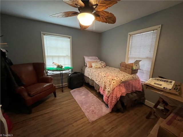 bedroom featuring a ceiling fan and wood finished floors