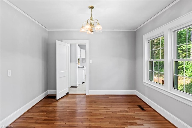 7090 Reynolda Rd, Pfafftown, NC 27040 - empty room featuring a chandelier, ornamental molding, and wood finished floors