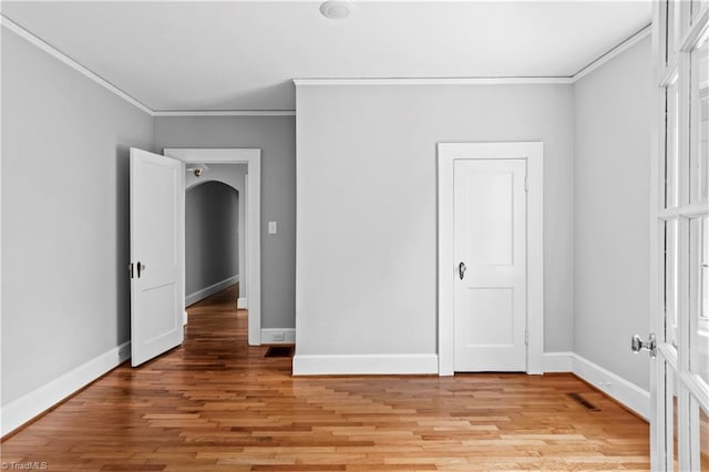 7090 Reynolda Rd, Pfafftown, NC 27040 - unfurnished room featuring crown molding and light wood-type flooring