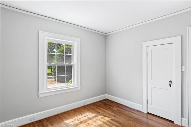 7090 Reynolda Rd, Pfafftown, NC 27040 - spare room featuring wood finished floors and crown molding