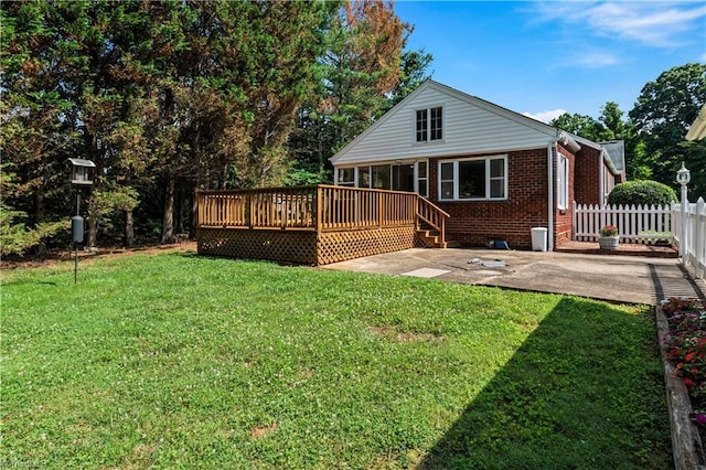 7090 Reynolda Rd, Pfafftown, NC 27040 - back of property with a wooden deck, brick siding, and a patio