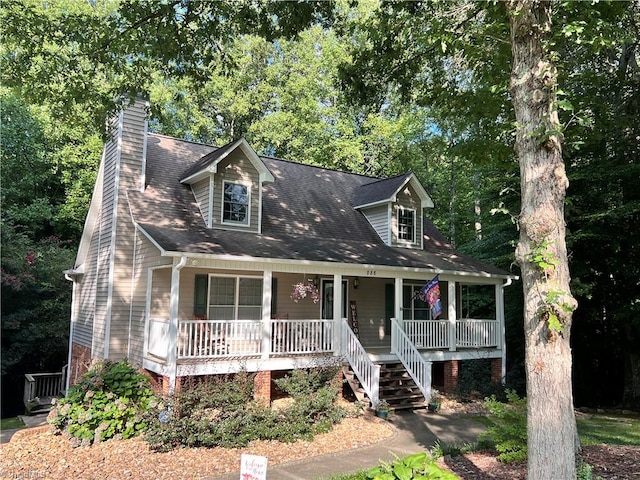 new england style home with a porch