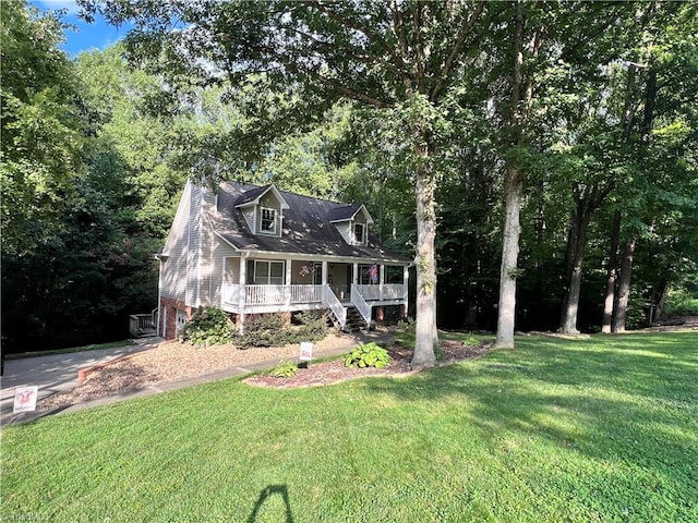 cape cod-style house with a front lawn and a porch