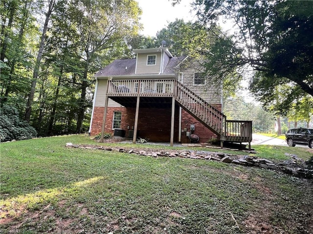 back of house with a wooden deck, central AC unit, and a yard