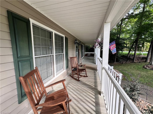 wooden terrace with a porch