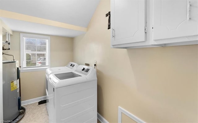 laundry room with washer and dryer, electric water heater, cabinet space, and baseboards