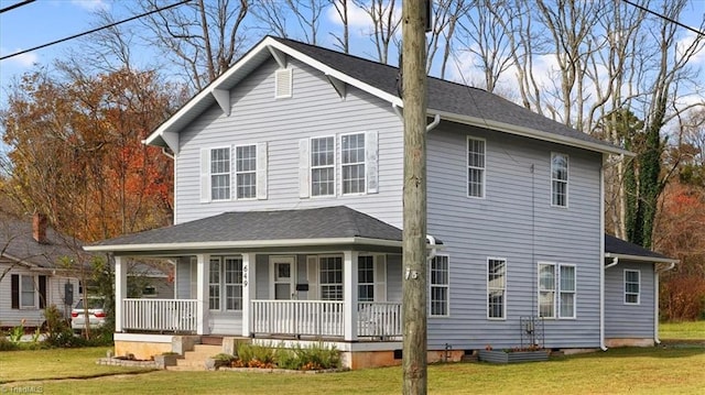 view of front of home with a porch, crawl space, and a front yard