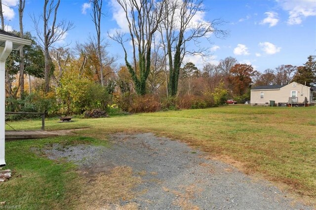 view of yard with an outdoor fire pit