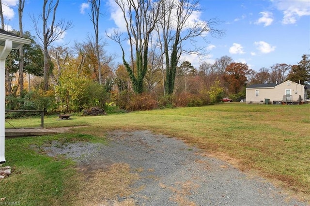 view of yard featuring an outdoor fire pit