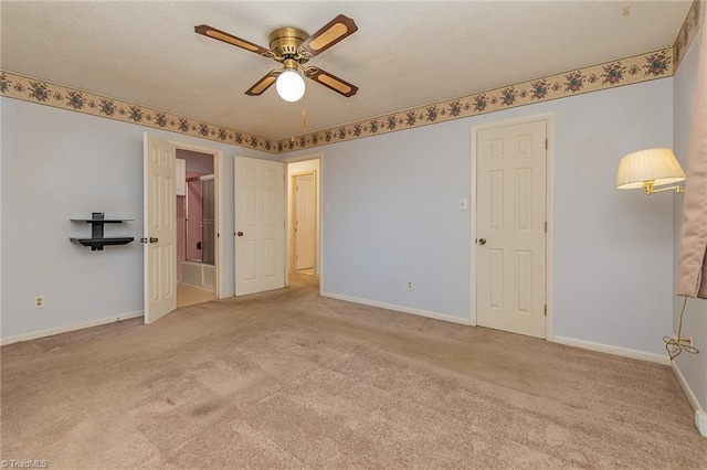 unfurnished bedroom with ceiling fan and light colored carpet