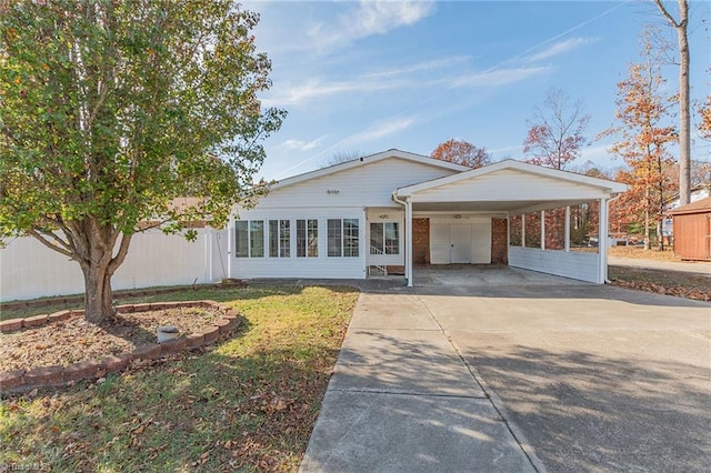 single story home featuring a carport