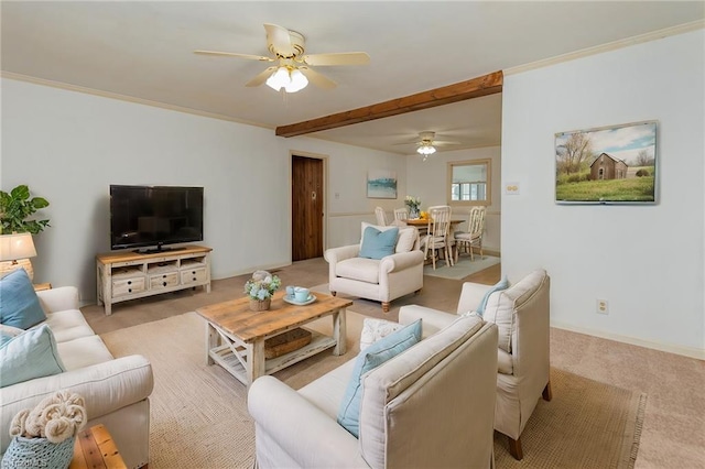 carpeted living room featuring beam ceiling, ceiling fan, and crown molding